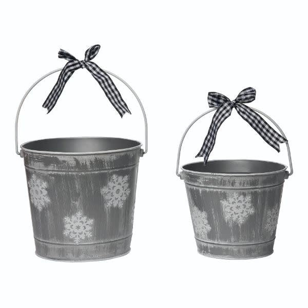 Metal snowflake buckets with a white winter decoration pattern.