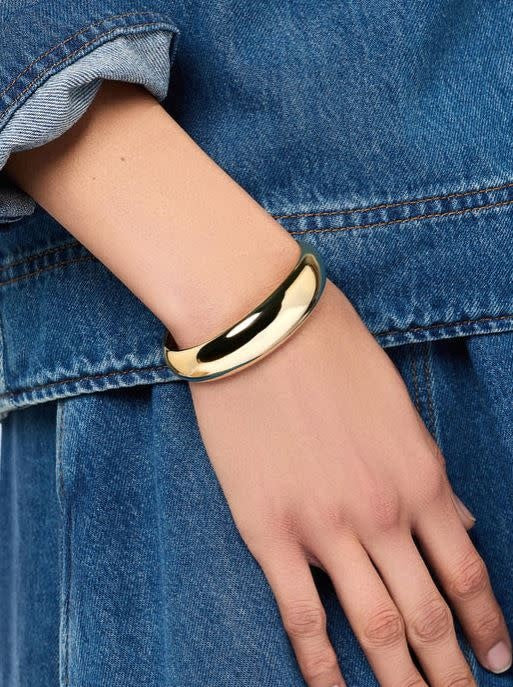Polished gold cuff bracelet with a chunky polished finish on brass