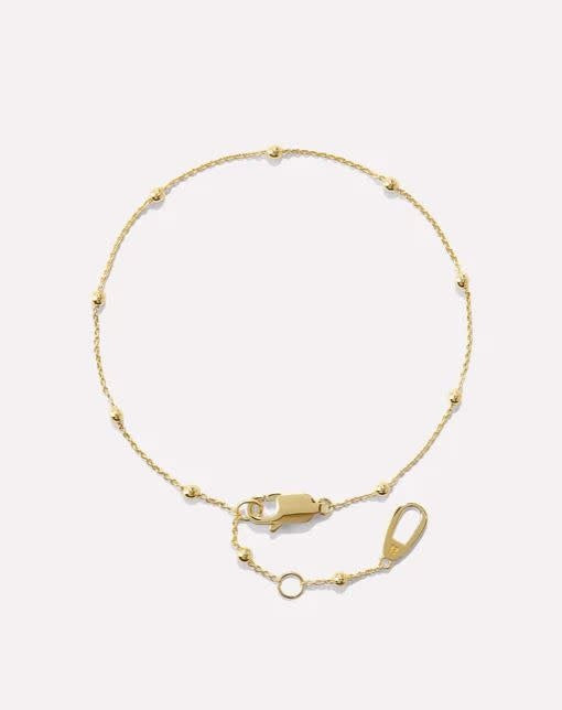 Delicate gold chain bracelet on recycled sterling silver with tiny bauble detailing