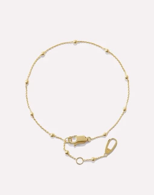 Delicate gold chain bracelet on recycled sterling silver with tiny bauble detailing
