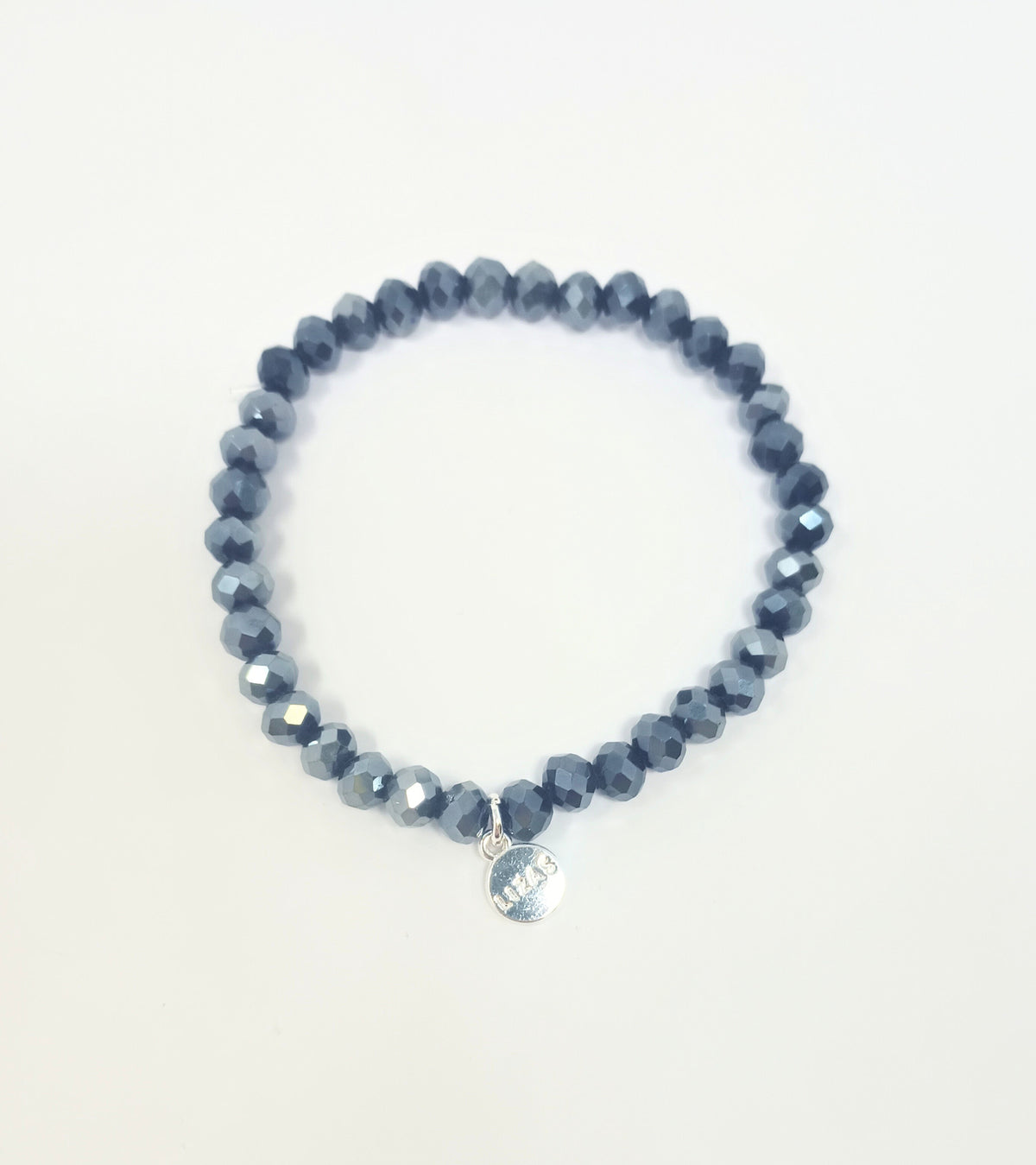 Stretchy beaded bracelet with faceted glass beads in a colorful pattern.
