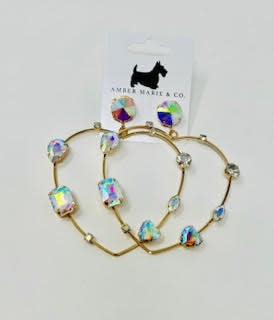 Heart-shaped earrings with crystal accents in a silver-tone finish.
