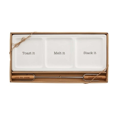 Ceramic s'mores tray with two metal skewers featuring wooden handles.