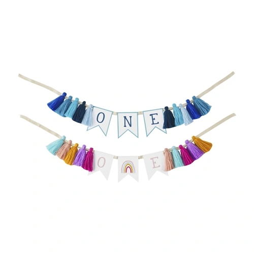 Paper first birthday banner with multi-color tassels on twill tape.