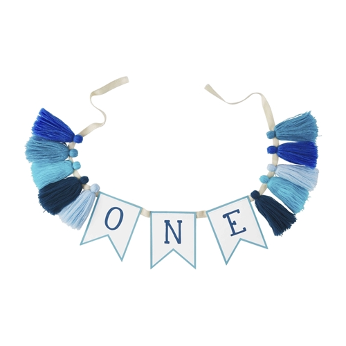 Paper first birthday banner with multi-color tassels on twill tape.