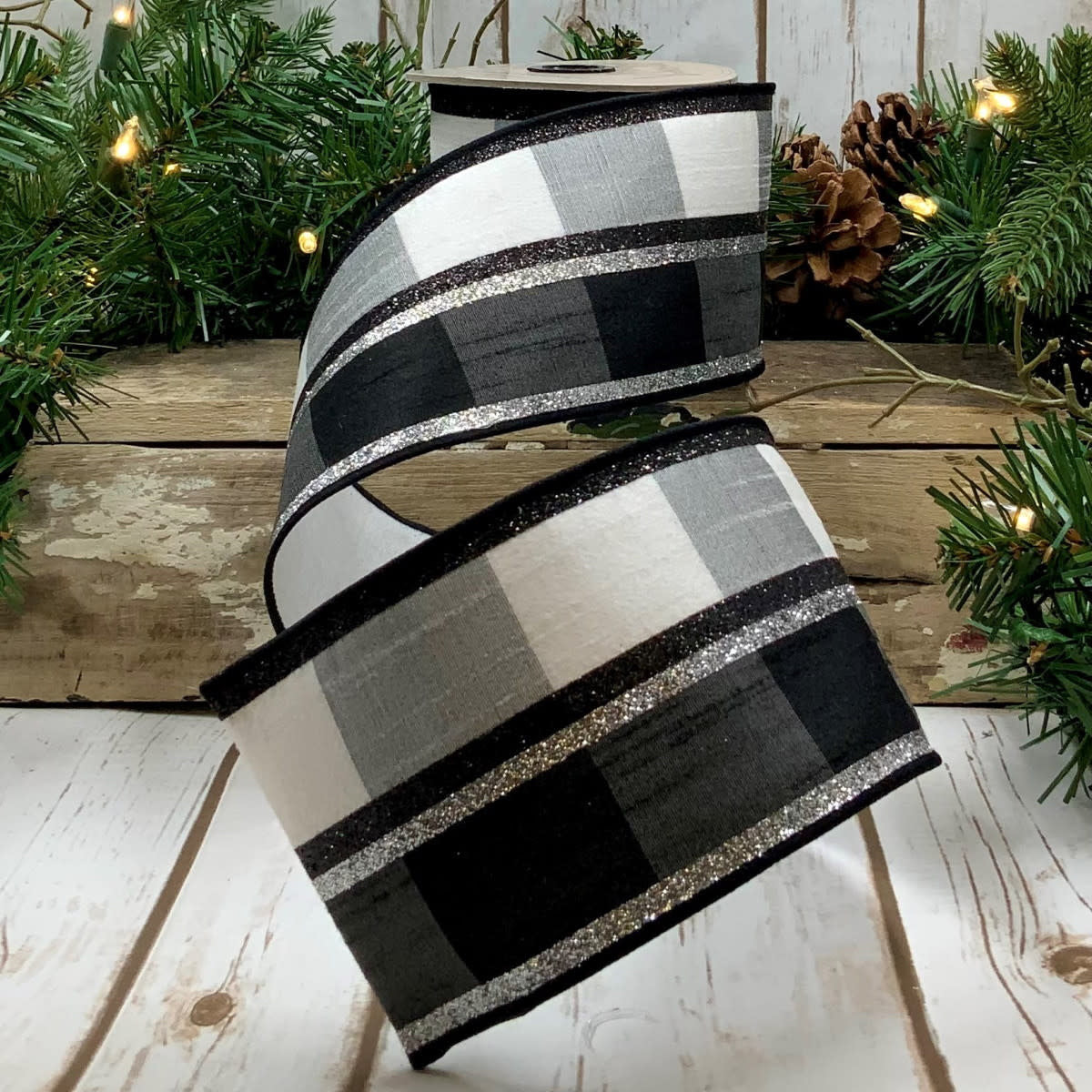 Faux dupion ribbon with a black, gray, and white buffalo check pattern and silver glitter stripes.