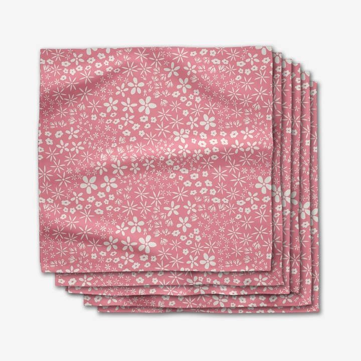 Set of six square Geosuede dinner napkins with a single-sided geometric print pattern.