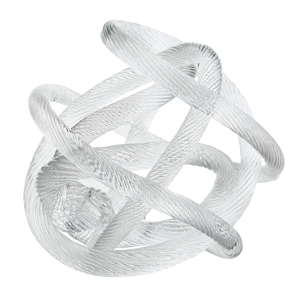 Polished glass decorative knot sculpture with smooth surface in neutral tone.