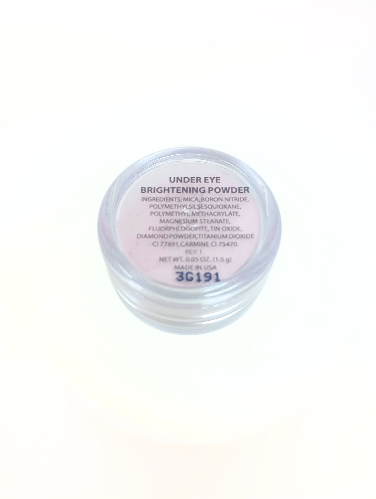 Under Eye Brightening Powder in a compact container with visible powder product.
