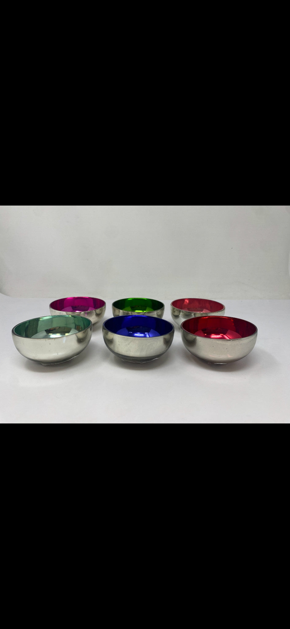 Glass floating tealight holder with silver electroplated rim