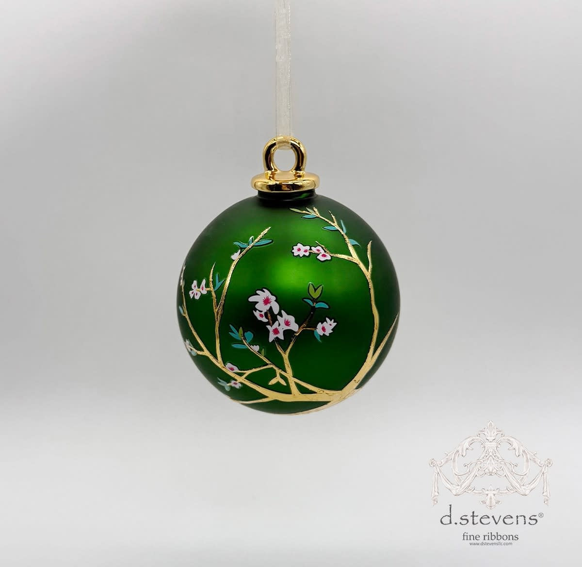 Emerald green 100mm glass ornament featuring gold cherry blossom branches and pink flower accents.
