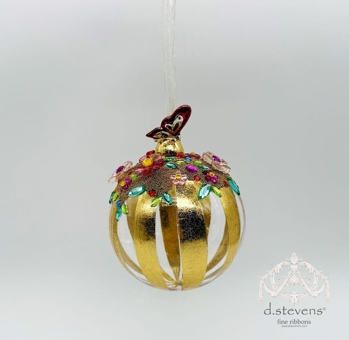 100mm clear and gold glass ball ornament decorated with colorful jewels and a butterfly topper.