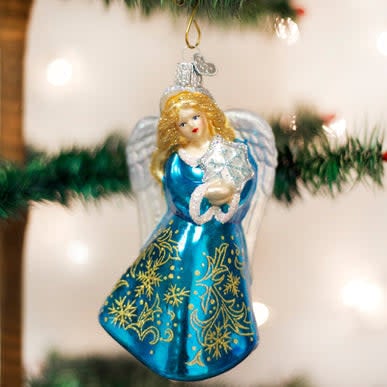 Glass angel ornament with snowflake accents in white and silver tones.