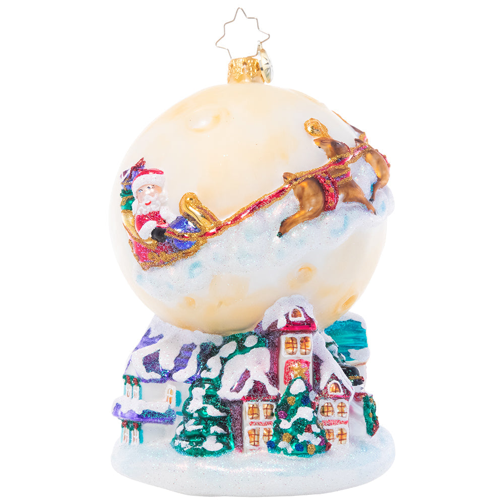 Christmas Eve ornament featuring Santa on reindeer against a glowing full moon sky.