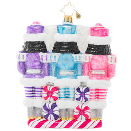 Three nutcracker figurines in pastel winter uniforms guarding a candy stash.