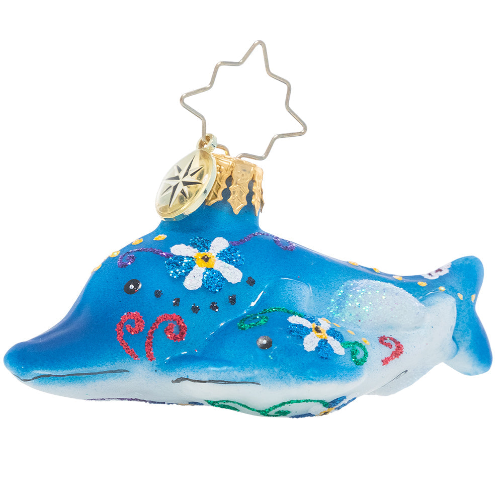 Small dolphin figurine with bright tropical floral patterns on a gem-like finish.
