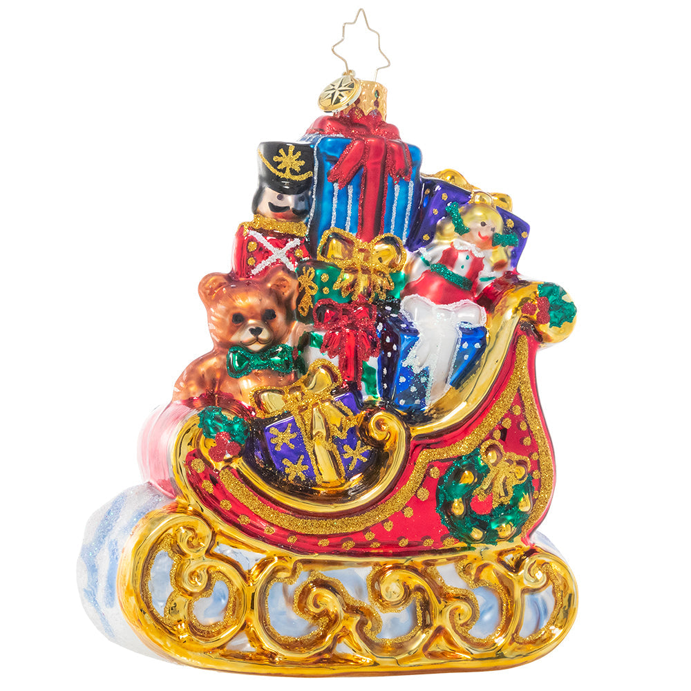 Gold gilded sleigh ornament filled with colorful Christmas presents