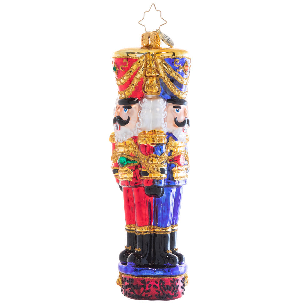 Three brown wooden nutcracker soldier figures with painted faces standing together.