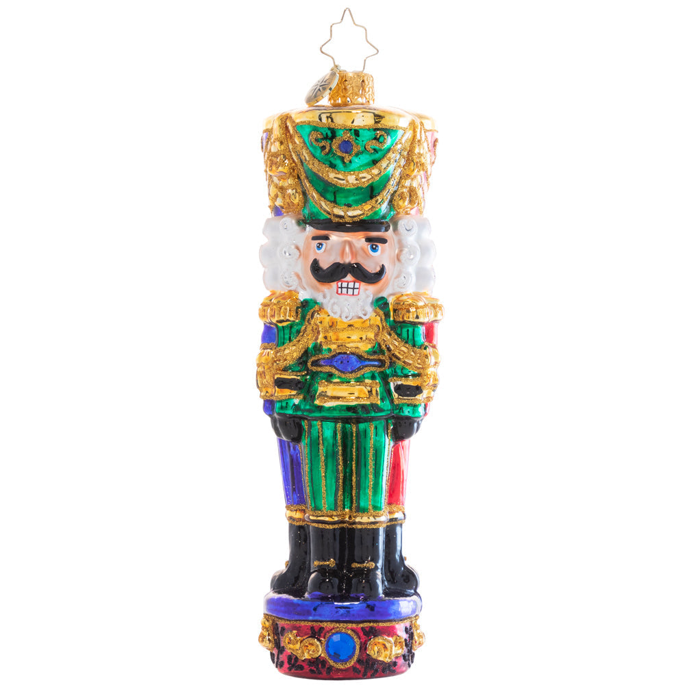 Three wooden nutcracker soldier figures in brown with red hats standing together.