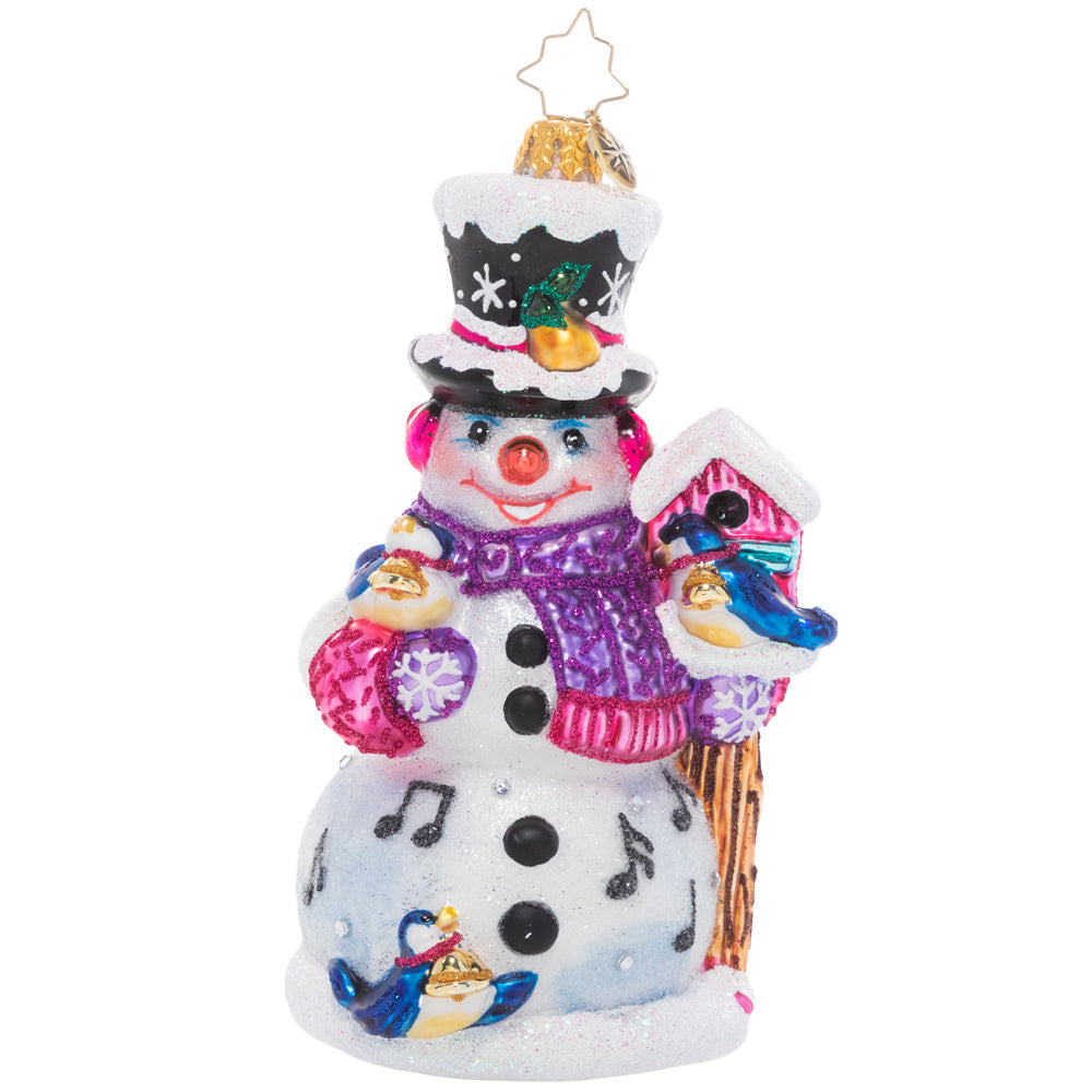 Snowman ornament with four blue birds singing on a snowy winter background