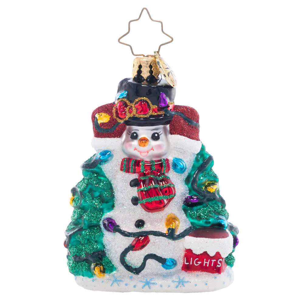Snowman figurine holding tangled Christmas lights with a festive holiday theme.