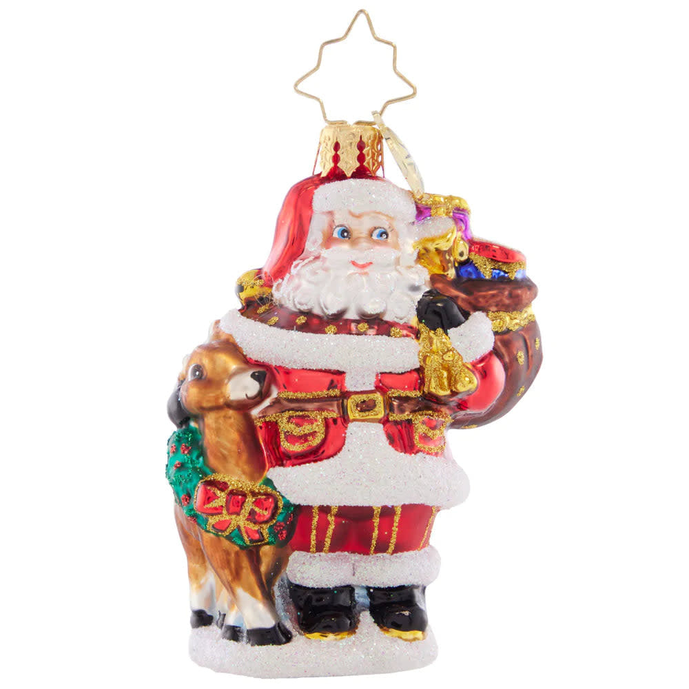 Woodland Walk Santa Gem figurine showing a red-clad Santa walking with an animal companion through snowy trees.