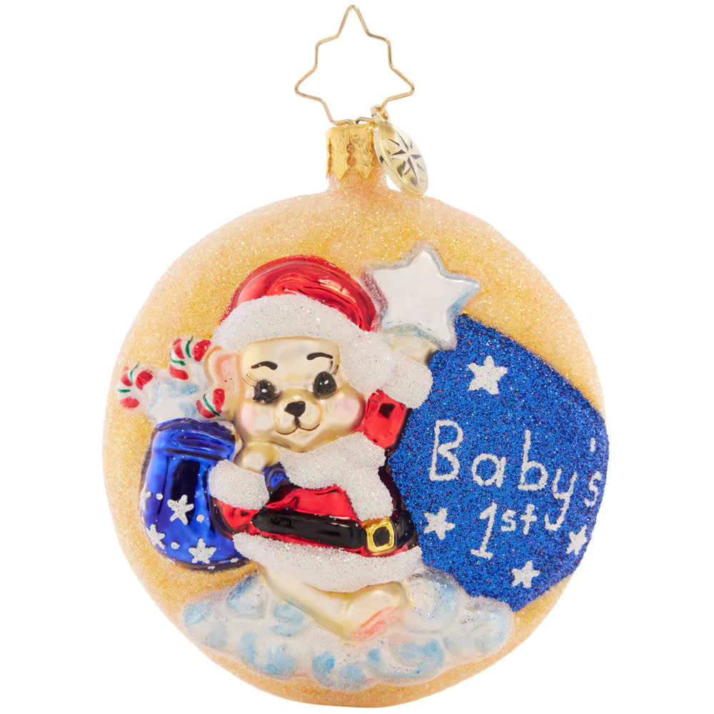Crescent-moon baby bear keepsake in white ceramic with a red Santa hat and green gem accent.