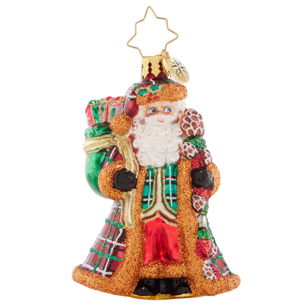 Plaid fur-trimmed Santa figurine in a cozy coat with snowy North Pole theme