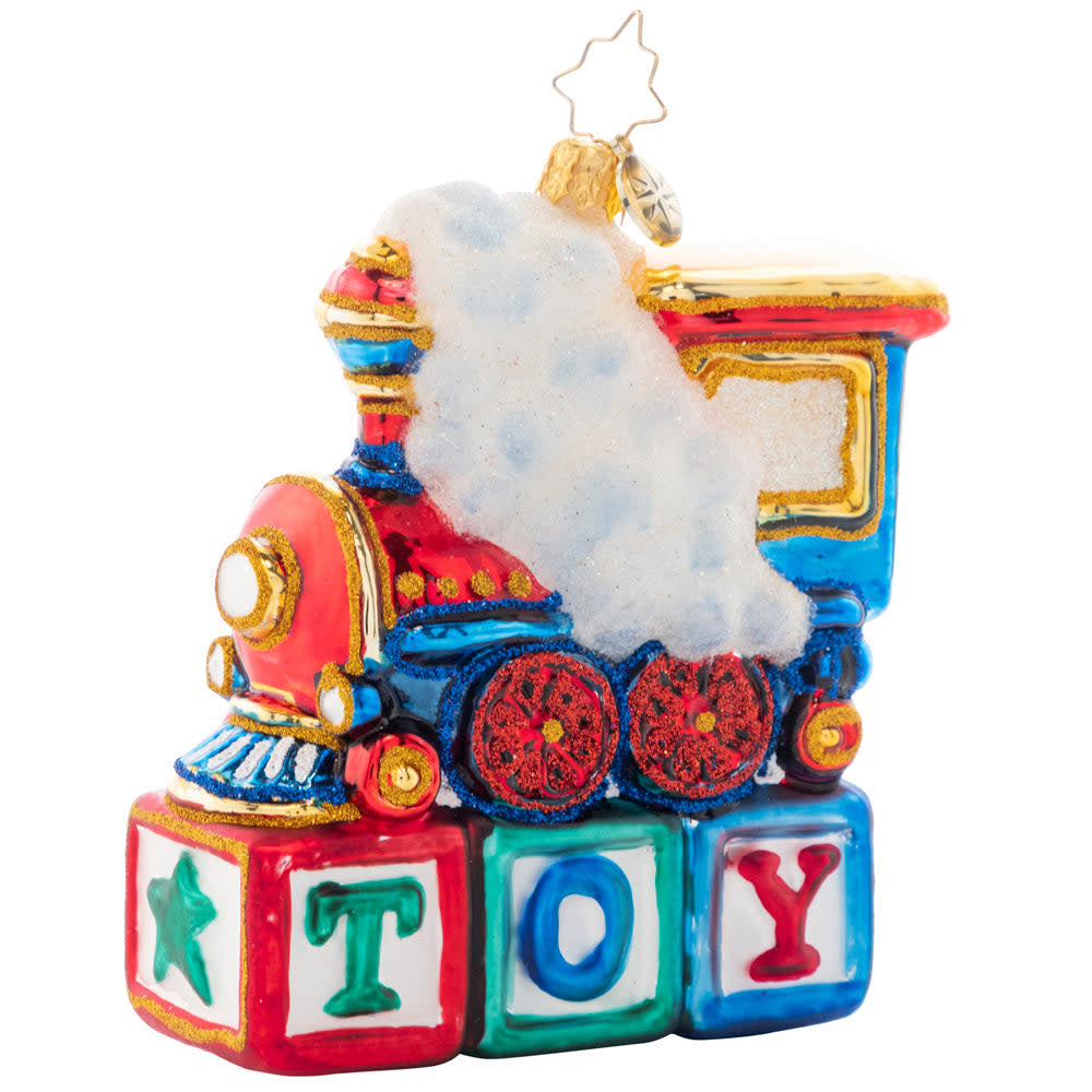 Wooden Choo Choo Cheer train toy perched on colorful blocks