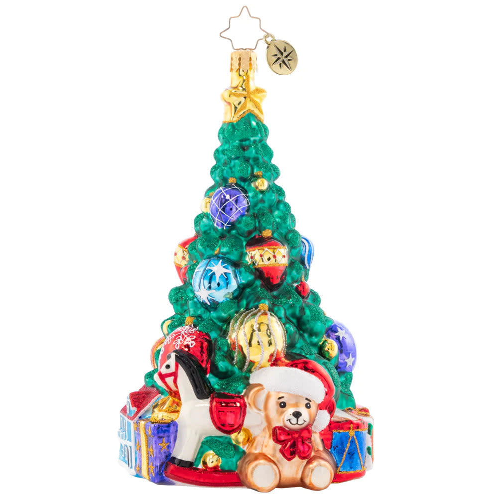 Tastefully Trimmed Tree ornament with toys hanging on branches.