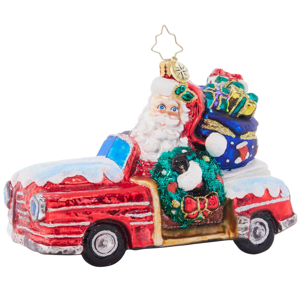 Wood-paneled Christmas cruiser sleigh with Santa figure