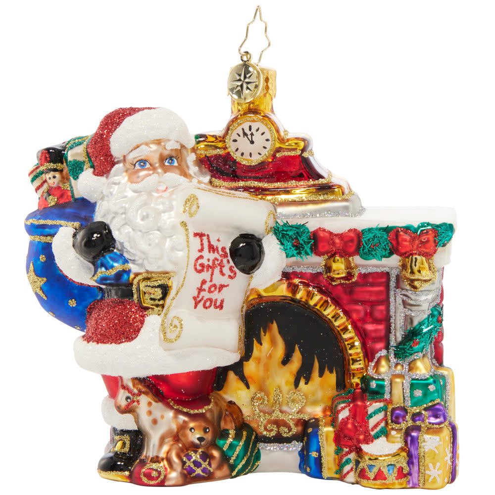 Nice List Santa figurine in red suit with white beard holding a list.