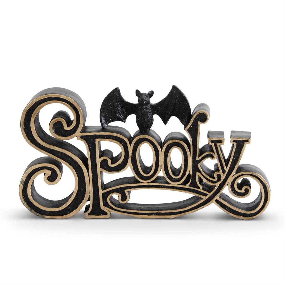 Black and gold resin SPOOKY cutout sign featuring a glittered bat accent.