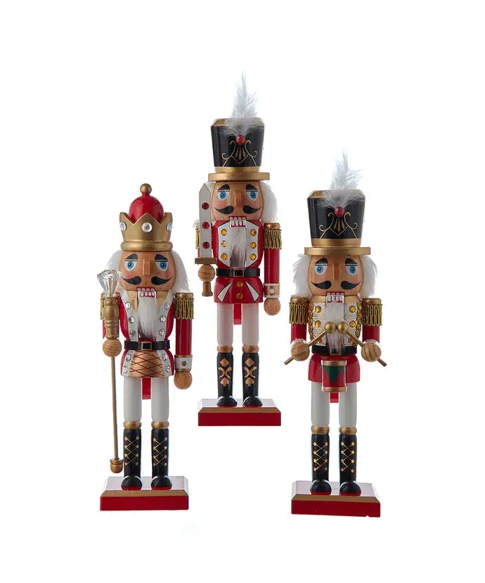 Three 10-inch wooden nutcracker figures in red and white uniforms with gold accents.