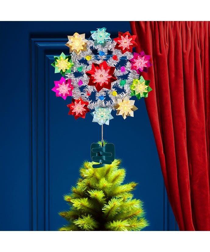 11-inch retro-style Christmas tree topper with multicolored flower design and silver tinsel.