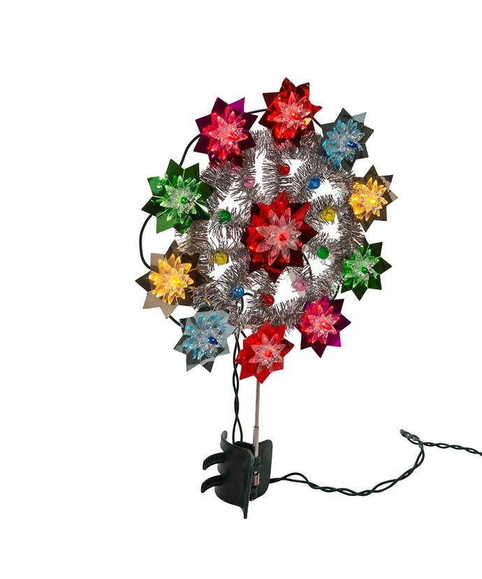 11-inch retro Christmas tree topper with multicolored flower lights and silver tinsel accents.