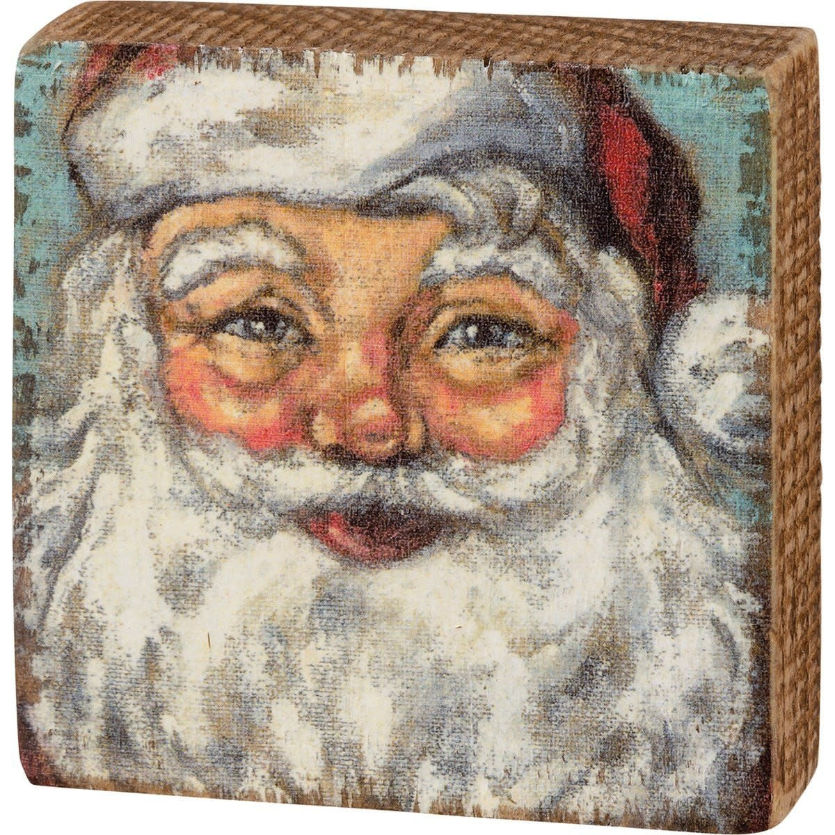 Red wooden block sign with white text reading Jesus Is The Reason For The Season.