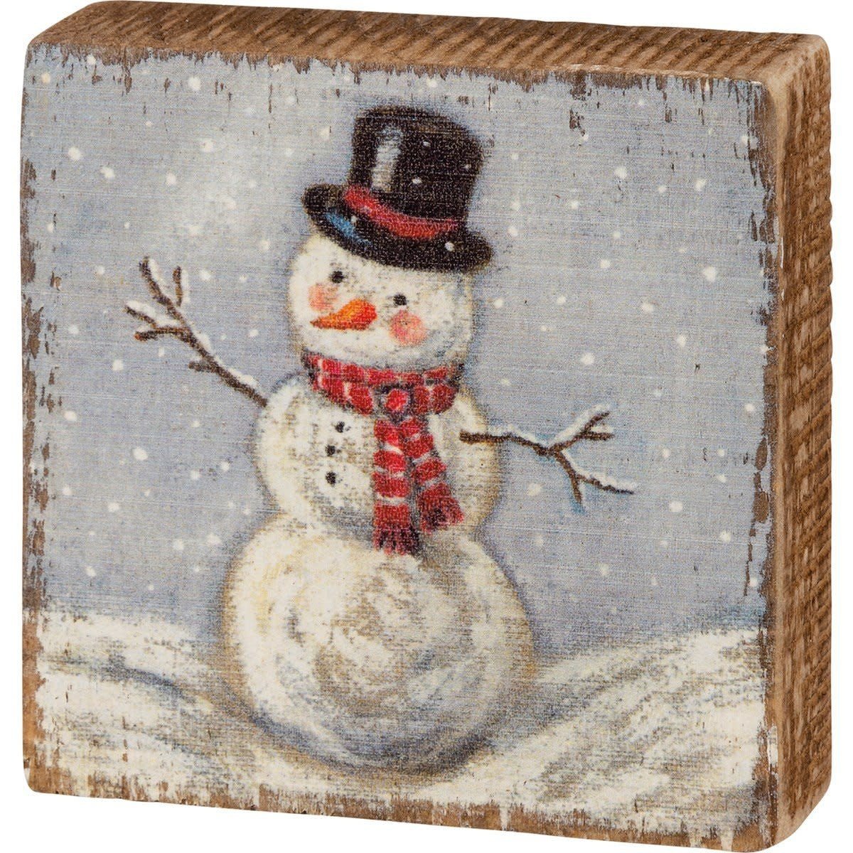 Red wooden block sign with white text reading Jesus Is The Reason For The Season.