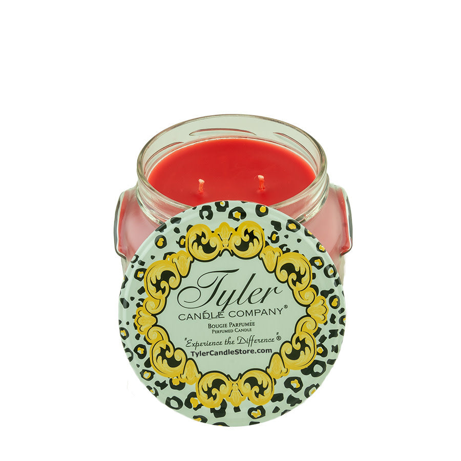 11oz Tyler Candle in a glass jar with a red wax interior and a leopard print lid.