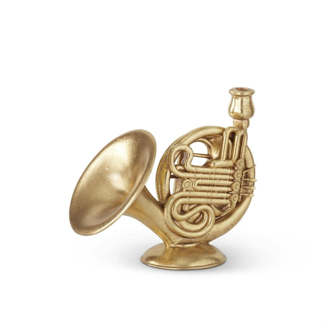 Gold-foiled French horn-shaped taper candleholder on a round base.