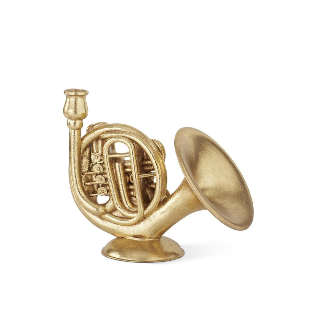 Gold-foiled French horn-shaped taper candleholder on a round base.