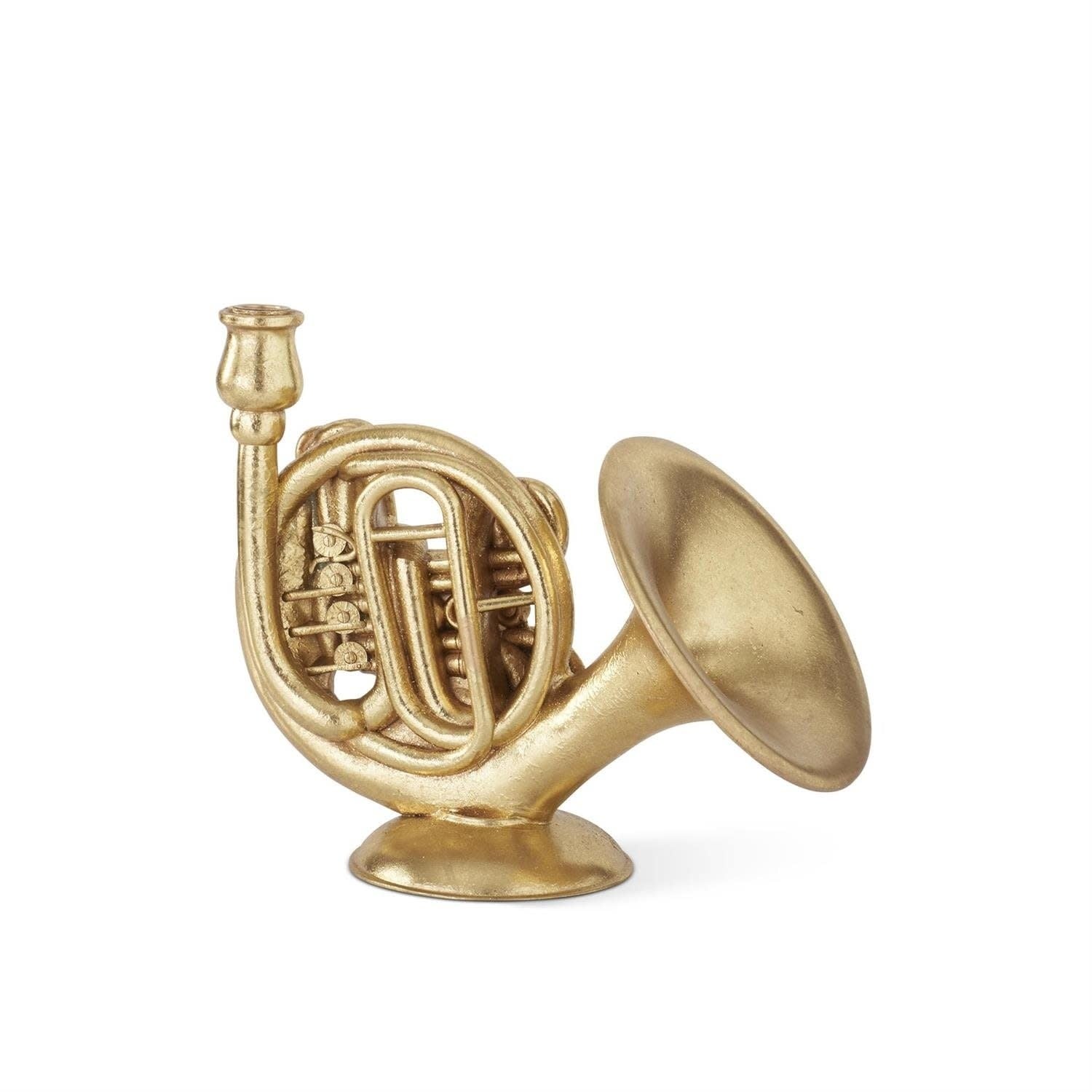 Gold-foiled French horn-shaped taper candleholder on a round base.