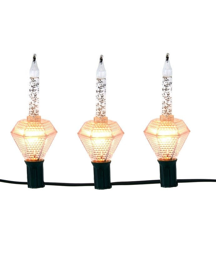 String of 7 diamond-shaped silver glitter bubble lights with candle-style tops on green wire.