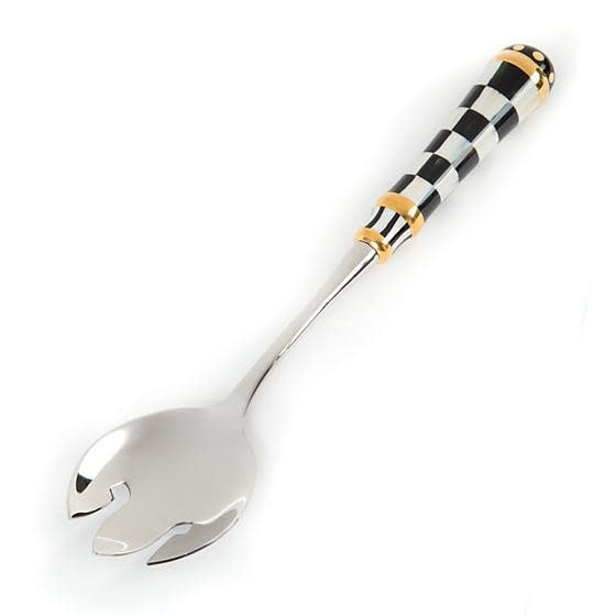 Two Courtly Check casserole forks with black-and-white porcelain handles featuring gold lustre accents and stainless steel tines.