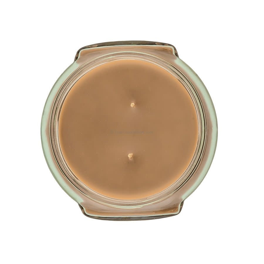 Top view of an 11oz Tyler candle in a glass jar with light brown wax and two wicks.
