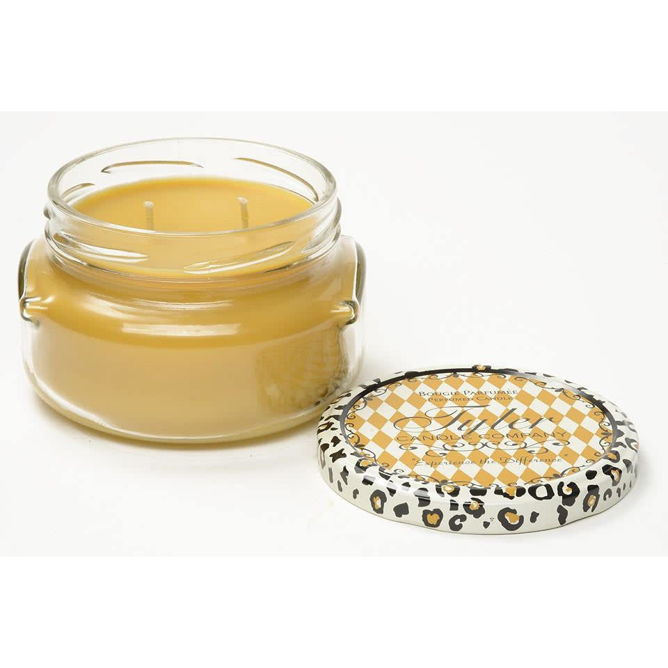 11oz Tyler Candle in a glass jar with a leopard print lid featuring a gold checkered pattern.