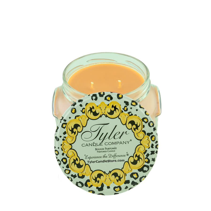 11oz Tyler Candle in a glass jar with a leopard print lid featuring gold baroque accents.