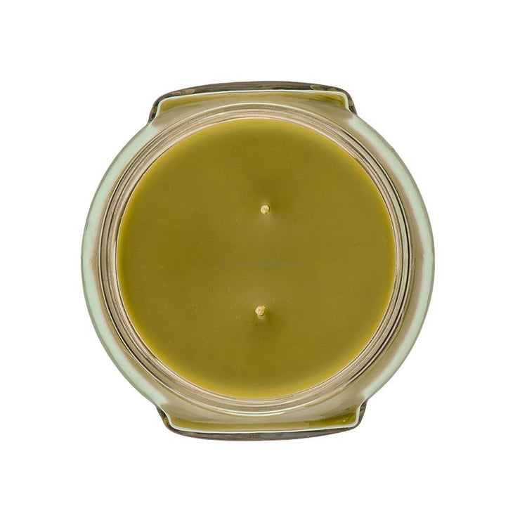 Top-down view of an 11oz Tyler candle in a glass jar with olive green wax and two wicks.