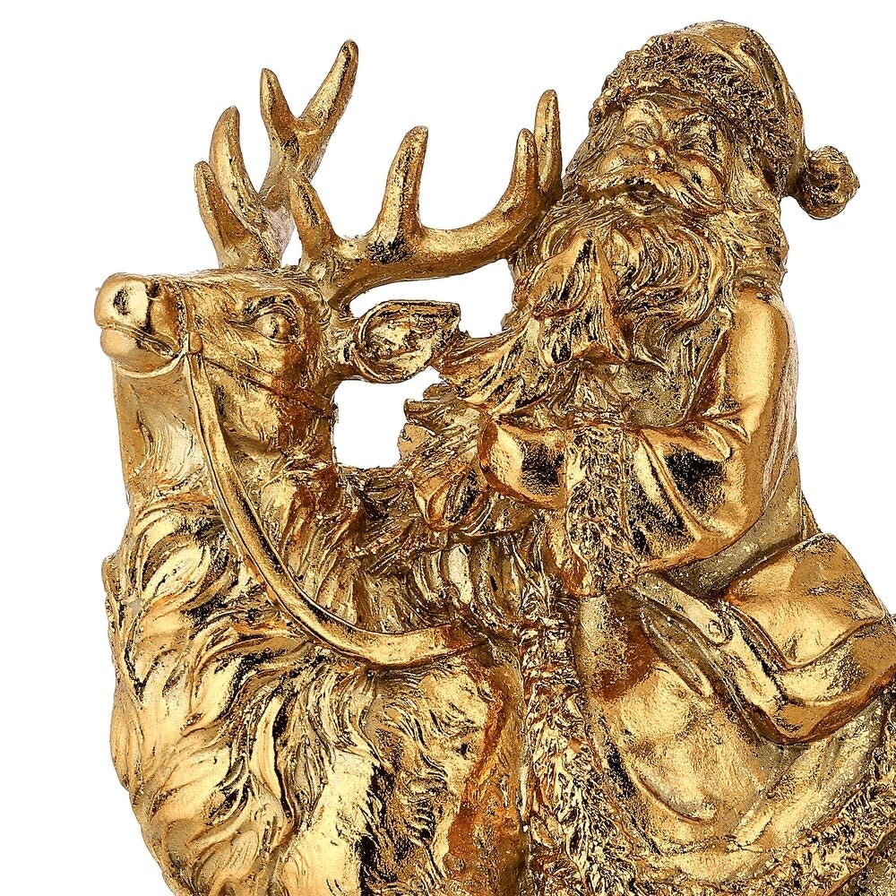 Gold resin Santa Claus figurine riding a deer, featuring intricate textures and a satchel.