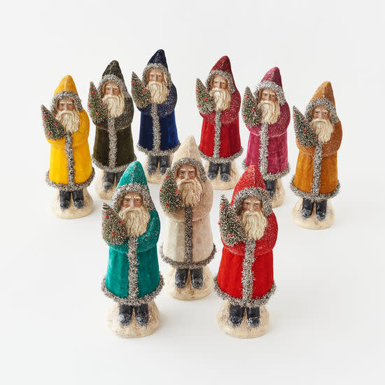 A collection of nine 12-inch resin Belsnickle figures in various velvet coat colors with tinsel trim.
